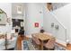 Bright dining room features a wooden table with seating for six, blue rug, and stairs to the second floor at 205 3Rd Street Northeast Ne St # 4, Atlanta, GA 30308