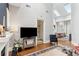 Bright living room featuring high ceilings, stylish decor, and hardwood flooring at 205 3Rd Street Northeast Ne St # 4, Atlanta, GA 30308