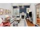 Comfortable living room with fireplace, stylish decor, and hardwood floors at 205 3Rd Street Northeast Ne St # 4, Atlanta, GA 30308