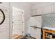 Mud room featuring white cabinets, a rear door, and decor at 205 3Rd Street Northeast Ne St # 4, Atlanta, GA 30308