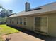 View of back exterior, patio and windows at 3505 Saddle Creek Ln, Ellenwood, GA 30294