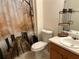 Bathroom with a toilet, vanity, sink, and shower with a themed shower curtain at 3505 Saddle Creek Ln, Ellenwood, GA 30294