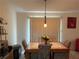 Cozy dining area featuring a tile-top table with decorative chairs and soft, natural lighting at 3505 Saddle Creek Ln, Ellenwood, GA 30294