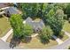 Aerial shot of a brick home with meticulously landscaped yard on a cul-de-sac at 997 Thousand Oaks Nw Bnd, Kennesaw, GA 30152