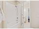Clean bathroom with a white tub, shower, and bright lighting at 997 Thousand Oaks Nw Bnd, Kennesaw, GA 30152