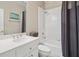 Clean bathroom featuring a white vanity, tub with shower, and neutral wall colors at 997 Thousand Oaks Nw Bnd, Kennesaw, GA 30152