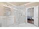 Elegant bathroom with white cabinets, a corner glass shower, and marble tile flooring at 997 Thousand Oaks Nw Bnd, Kennesaw, GA 30152