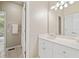 Bright bathroom with a white vanity, a large mirror, decorative lighting, and tile flooring at 997 Thousand Oaks Nw Bnd, Kennesaw, GA 30152