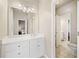 Bright bathroom with a single vanity and views to the bedroom and toilet at 997 Thousand Oaks Nw Bnd, Kennesaw, GA 30152