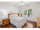 Cozy bedroom with wood floors, a ceiling fan, and a bright window view at 997 Thousand Oaks Nw Bnd, Kennesaw, GA 30152