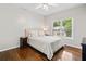 Comfortable bedroom with a bed, nightstand, and large window at 997 Thousand Oaks Nw Bnd, Kennesaw, GA 30152