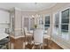 Cozy breakfast nook with bay windows and a chandelier, adjacent to the kitchen at 997 Thousand Oaks Nw Bnd, Kennesaw, GA 30152