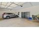 Spacious garage with ample storage, a parked SUV, and plenty of room for organization at 997 Thousand Oaks Nw Bnd, Kennesaw, GA 30152