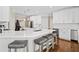 Modern kitchen with white cabinets, quartz countertops, stainless steel appliances, and a center island at 997 Thousand Oaks Nw Bnd, Kennesaw, GA 30152
