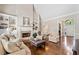 Open living area with hardwood floors, fireplace, built-in bookshelves, and lots of natural light at 997 Thousand Oaks Nw Bnd, Kennesaw, GA 30152