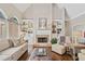 Cozy living room with a brick fireplace, built-in bookshelves, and comfortable seating at 997 Thousand Oaks Nw Bnd, Kennesaw, GA 30152