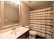 Neutral bathroom with a single sink vanity, toilet, and shower/tub combo at 3589 Tamerton Trce, Buford, GA 30519