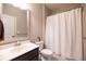 Bathroom features a single sink vanity, toilet, and tub with shower at 3589 Tamerton Trce, Buford, GA 30519