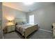 Cozy bedroom featuring neutral tones, soft lighting and a comfortable bed at 3589 Tamerton Trce, Buford, GA 30519