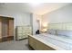 Relaxing bedroom with neutral colors, a dresser, and carpet flooring at 3589 Tamerton Trce, Buford, GA 30519