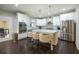 Bright kitchen features stainless steel appliances, white cabinets and granite countertops at 3589 Tamerton Trce, Buford, GA 30519