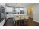 Well-lit kitchen boasts a large island, stainless steel appliances and modern finishes at 3589 Tamerton Trce, Buford, GA 30519