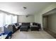 Expansive living room with a large sectional sofa, plush carpet, and ample space for relaxation and entertainment at 3589 Tamerton Trce, Buford, GA 30519