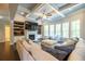 Comfortable living room with fireplace, built-ins, and tray ceiling at 3589 Tamerton Trce, Buford, GA 30519