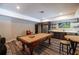 Recreation room featuring a pool table, bar area, and seating, perfect for entertaining guests at 3589 Tamerton Trce, Buford, GA 30519