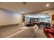 Spacious recreation room featuring comfortable seating, a pool table, a bar, and a large TV screen at 3589 Tamerton Trce, Buford, GA 30519