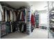 Spacious and organized walk-in closet with custom shelving and storage for shoes and clothing at 3589 Tamerton Trce, Buford, GA 30519