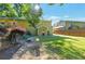 Spacious backyard with a green lawn, surrounded by a wooden fence and mature trees for added privacy at 1025 Whitfield Ct, Smyrna, GA 30080