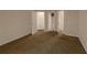 Expansive bedroom featuring neutral carpet with doorways and access to an ensuite bathroom at 1025 Whitfield Ct, Smyrna, GA 30080