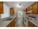 Functional kitchen with standard appliances, ample counter space, and wood cabinetry, ready for your personal touch at 1025 Whitfield Ct, Smyrna, GA 30080