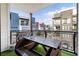 Outdoor balcony with a grill, picnic table, and views of the neighborhood at 395 Pratt Drive Se # No 802, Atlanta, GA 30315