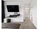Bedroom featuring mounted flat screen TV, complemented by an open doorway at 395 Pratt Drive Se # No 802, Atlanta, GA 30315