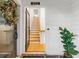 Bright foyer showcasing hardwood floors, leading to stairs, with white walls and decor at 395 Pratt Drive Se # No 802, Atlanta, GA 30315