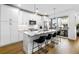 Modern kitchen with white cabinets, stainless steel appliances, and a large island with seating at 395 Pratt Drive Se # No 802, Atlanta, GA 30315