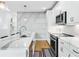 Well-lit kitchen with marble countertops, stainless steel appliances, and a view into an adjoining living space at 395 Pratt Drive Se # No 802, Atlanta, GA 30315