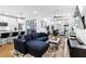 Open-concept living room with a modern kitchen, dining area, comfortable sofa, and sleek furnishings at 395 Pratt Drive Se # No 802, Atlanta, GA 30315