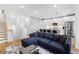 Bright and airy living room featuring a modern kitchen, cozy seating area, and hardwood floors at 395 Pratt Drive Se # No 802, Atlanta, GA 30315