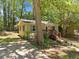 Charming single story home with a landscaped front yard, complemented by a wooden porch at 4614 Ridge Dr, Pine Lake, GA 30072