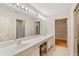 Bright primary bath with dual sink vanity, tile floor, and separate access to the shower and walk-in closet at 5336 Stone Village Nw Cir # 2, Kennesaw, GA 30152