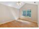 Bedroom with hardwood floors, ceiling fan, and large window at 5336 Stone Village Nw Cir # 2, Kennesaw, GA 30152