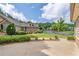 Landscaped front yard view of home featuring stone accents and mature trees at 5336 Stone Village Nw Cir # 2, Kennesaw, GA 30152