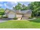 Charming home featuring a manicured lawn, attached garage, and stone accents at 5336 Stone Village Nw Cir # 2, Kennesaw, GA 30152