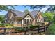 Spacious home featuring a stone and siding facade, complemented by a large screened porch at 5336 Stone Village Nw Cir # 2, Kennesaw, GA 30152