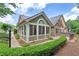 Spacious home featuring a stone and siding facade, complemented by a large screened porch at 5336 Stone Village Nw Cir # 2, Kennesaw, GA 30152