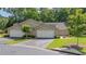Exterior showcasing two garages with meticulously maintained front yard at 5336 Stone Village Nw Cir # 2, Kennesaw, GA 30152