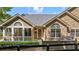 Charming home featuring a stone and siding facade, complemented by well-manicured landscaping at 5336 Stone Village Nw Cir # 2, Kennesaw, GA 30152